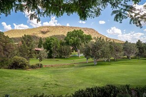 Bask in the View of the Golf Course and Greenery out the Dining Room Window