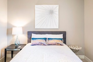 Your sanctuary with this cozy bed setup! 🌟 Nothing beats the elegance of a white comforter against a stylish backdrop.