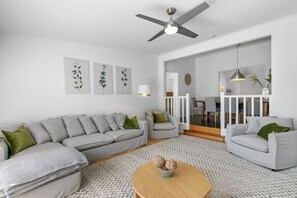 An expansive L-shaped lounge offers ample space for the whole group to come together for movie nights.