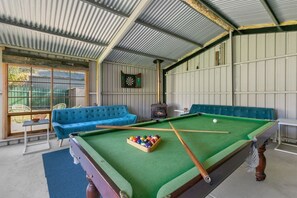 A games room comes with a snooker table, darts, and board games for your entertainment, while the lounge area offers a cosy fireplace for those chilly evenings.