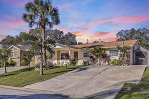 Ample parking space is provided in the large driveway to accommodate multiple cars.