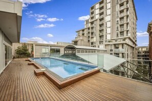 Enjoy leisurely swims at the shared rooftop pool.