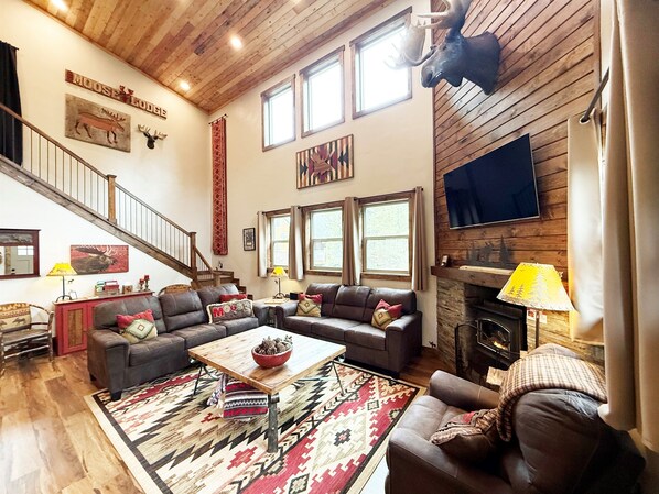 Relax and unwind in the two-story family room with propane fireplace, Smart TV, games, etc. No animals were harmed in the making of 'Mangy Morris' our awesome faux mounted moose.