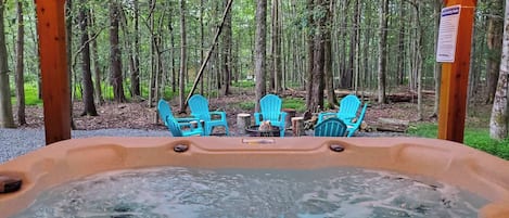 Unwind anytime in your private hot tub—perfect for soothing soaks under the stars