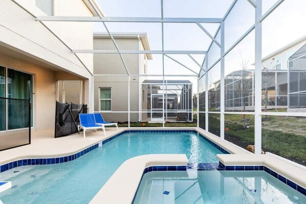 Pool and hot tub with 4 sun loungers and patio dining table with seating for 8.