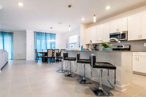 Open concept kitchen,dining and living room ground floor-view from entryway