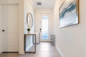 Front door with smart lock,child lock and shoe rack.No shoes allowed inside.