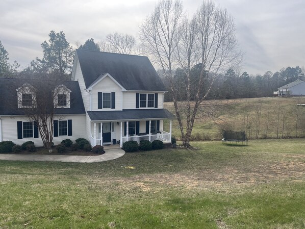 4 Bedroom home sitting on 1.5 acres with the forest in the back.