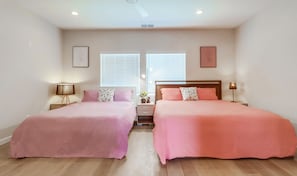 Bedroom 1 offers a cozy king & queen bed with a nearby workspace