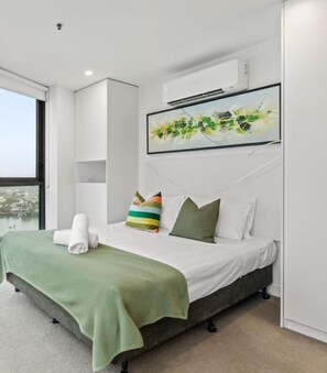 The Studio room offers air-conditioning and a comfortable queen bed. It features floor-to-ceiling windows, allowing ample natural light and providing stunning 180-degree views.