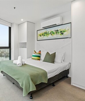 The Studio room offers air-conditioning and a comfortable queen bed. It features floor-to-ceiling windows, allowing ample natural light and providing stunning 180-degree views.