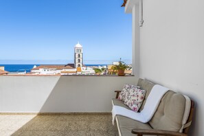Terrace with sitting area & ocean/city view