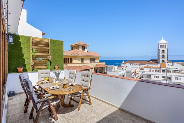 Terrace w/outside dining area & stunning ocean/city view