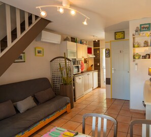 Air-conditioned living room opening onto the kitchen