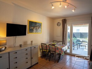 Air-conditioned living room opening onto south-facing terrace