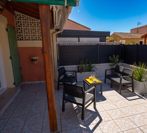 South-facing terrace with garden furniture