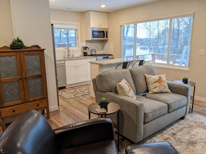 Living area with window overlooking waterfront