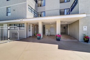 Entrance to the building with gated pool 