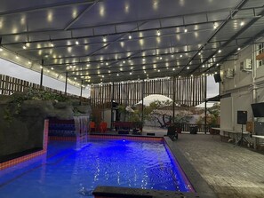 Pool with lights  and waterfall