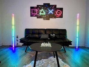 Our game room features a new leather futon for additional sleeping space