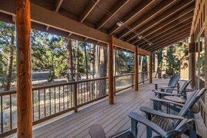 Unwind in Adirondack chairs while soaking in the peaceful forest views—an ideal spot for morning coffee or evening stargazing