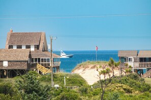 Enjoy peak-a-boo views of the ocean from the top-level furnished deck!