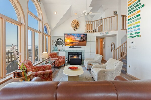 The spacious top-level living area is thoughtfully designed. (Please note: Fireplace is not for guest use.)