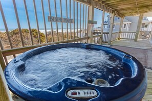 Enjoy ocean views while you soak in the bubbly hot tub.