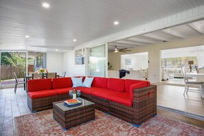 Large screened-in area with multiple stacked sliding doors