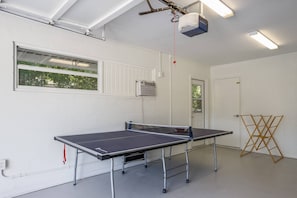 The garage has a pingpong table and a window A/C unit. Have fun!