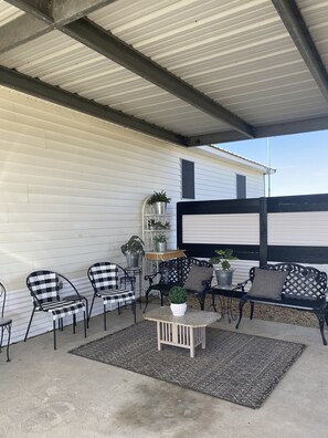 Fantastic outdoor seating area , gas grill, under roof.