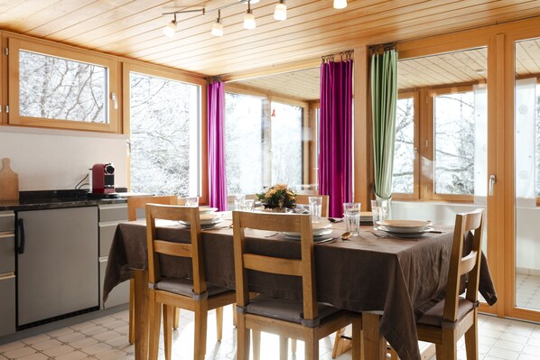 Dining area with view into the conservatory
