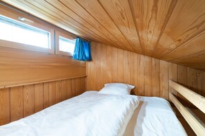 Sleeping accommodation above the room with the single bed on the open gallery