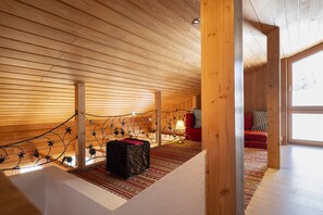 Gallery on the upper floor with view into the living area