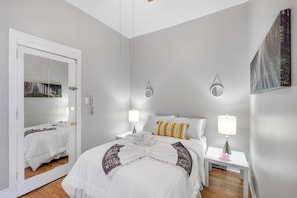 Full size bedroom and bed with closet space, plush linen and comforters, soft lighting and a great energy to rest and enjoy a good nights sleep.