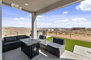 Lower deck with seating, fire pit and hot tub