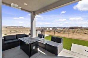 Lower deck with seating, fire pit and hot tub