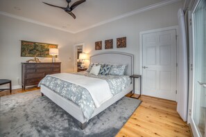 The first-floor primary bedroom with a luxurious King bed.