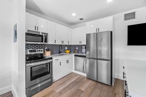 Fully stocked kitchen with all the pots/ pans and utensils you need
