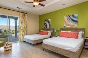 This charming master bedroom comes with two twin beds and an easy access to the pool area