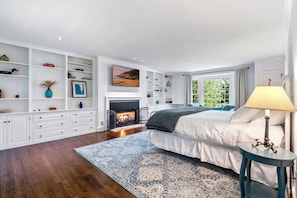 Master BR with king-size bed, dresser, a 55" TV and ensuite bathroom.