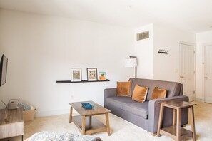 Spacious living room with private balcony