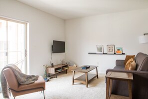 Spacious living room with private balcony