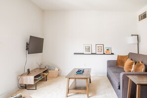 Spacious living room with private balcony