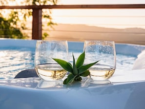 Relax in the jacuzzi with stunning mountain views