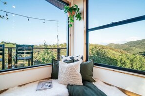 Transform your living room into a bedroom offering both comfort and mountain views