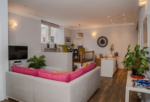 The open-plan sitting, dining and kitchen area