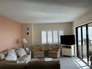 Living room space is beachy and comfy!