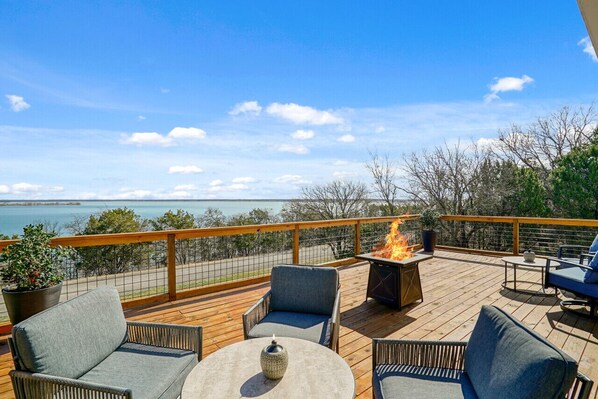 Relax and unwind on this deck featuring comfortable seating, and a sizzling BBQ grill