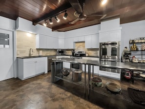 Newly remodeled elegance: A spacious, open kitchen fully stocked and ready to inspire culinary creativity.